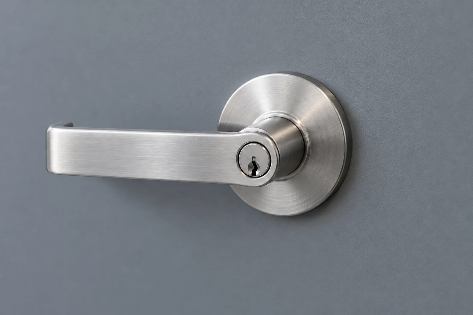 Illustrative satin chrome commercial lever lockset on a gray steel door.